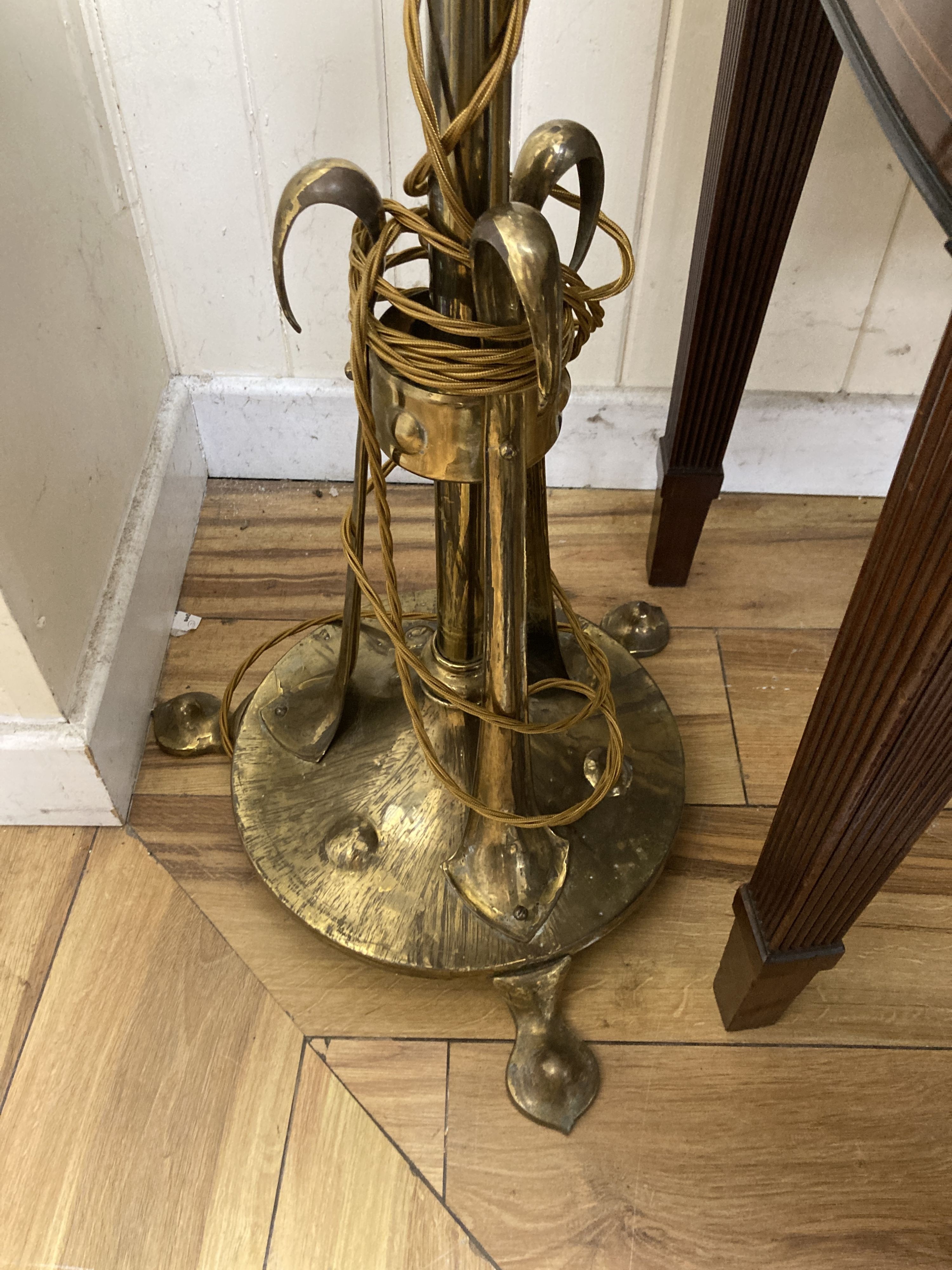 An Arts and Crafts brass telescopic standard lamp.